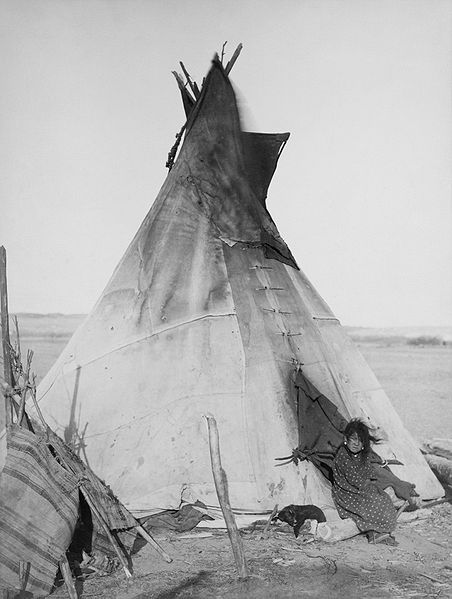 452px-Oglala_girl_in_front_of_a_tipi2.jpg